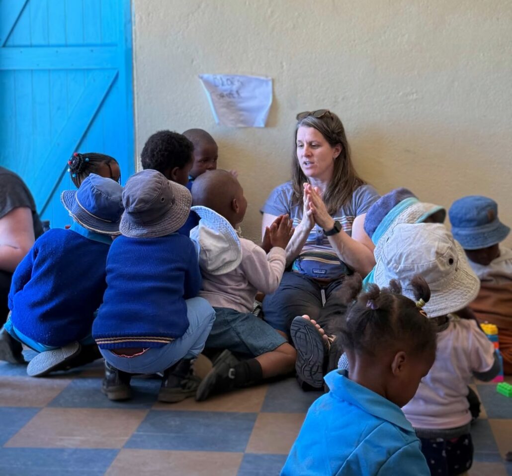 Ellen Block, CSBSJU Anthropology Professor and Director of TTLF plays with children at one of the village preschools.